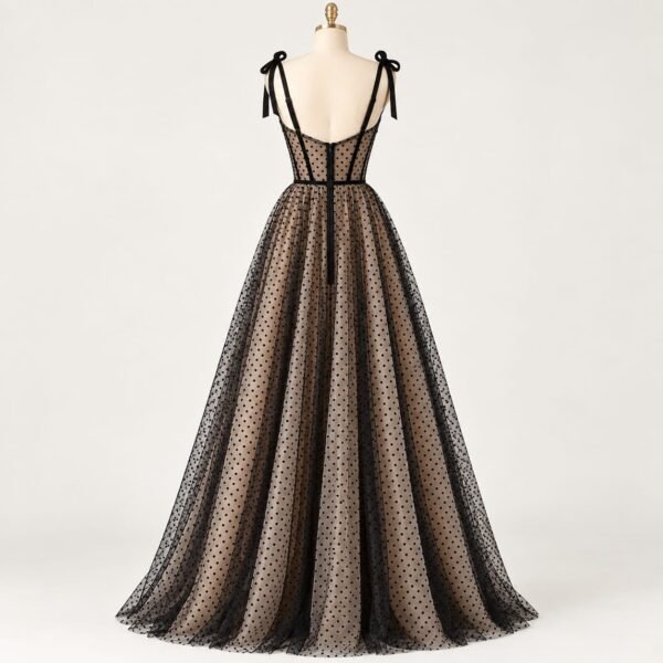 Back view of SELLBAY Black Dot Couture Gown with structured corset bodice, black net detailing and full flare skirt