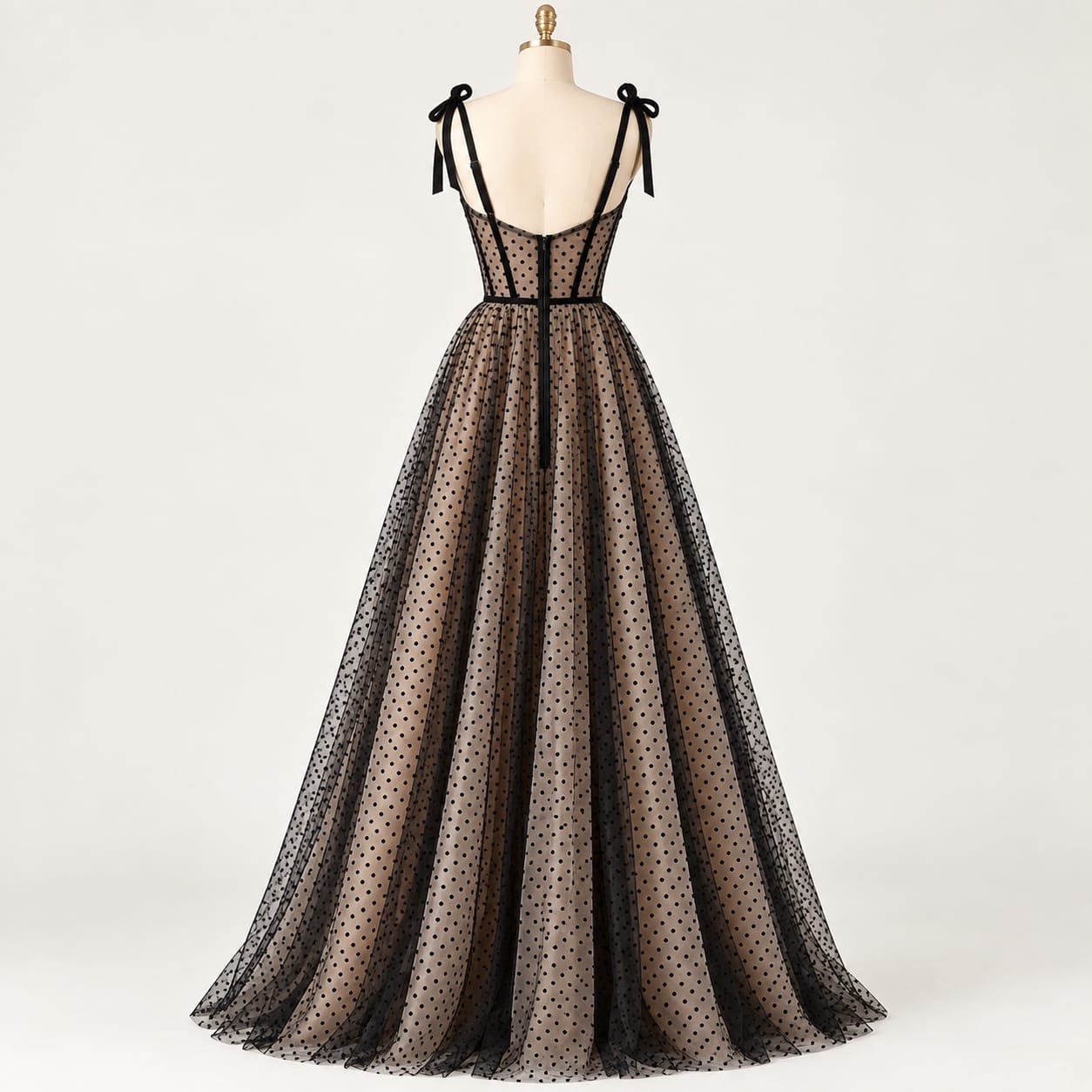 Back view of SELLBAY Black Dot Couture Gown with structured corset bodice, black net detailing and full flare skirt