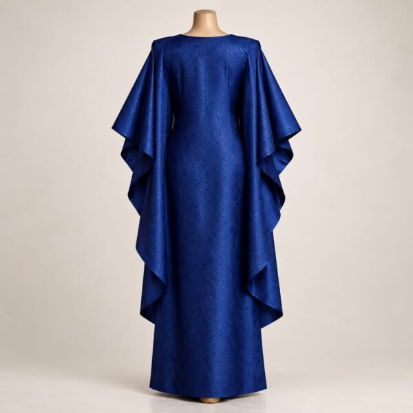SELLBAY AFRO JAMA KAFTAN in royal blue jacquard fabric featuring a full-length flowing silhouette and dramatic layered cape sleeves displayed on a mannequin.