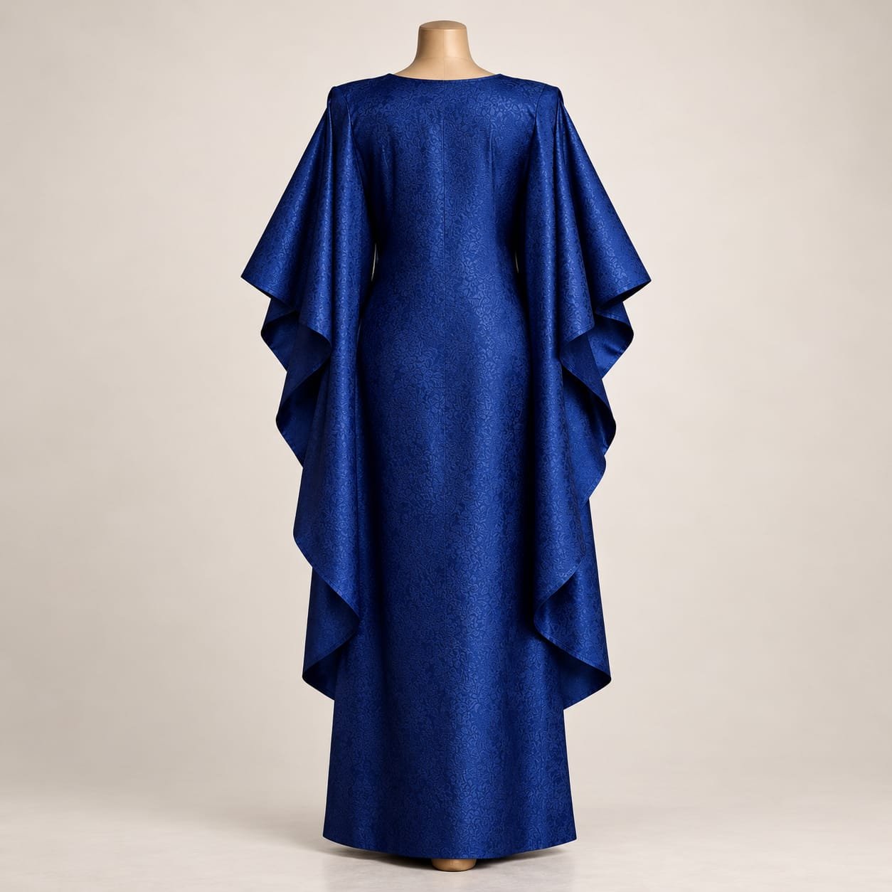 SELLBAY AFRO JAMA KAFTAN in royal blue jacquard fabric featuring a full-length flowing silhouette and dramatic layered cape sleeves displayed on a mannequin.