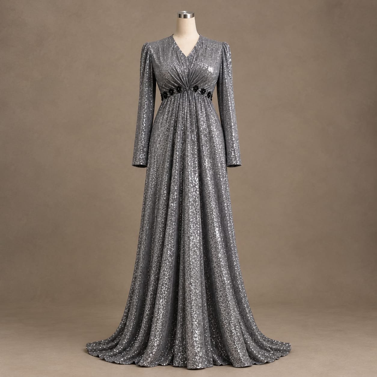 SELLBAY Moonlight Maxi silver-gray sparkling floor-length gown with long sleeves, ruched waist, black floral waist detailing, and flowing train displayed on a mannequin.