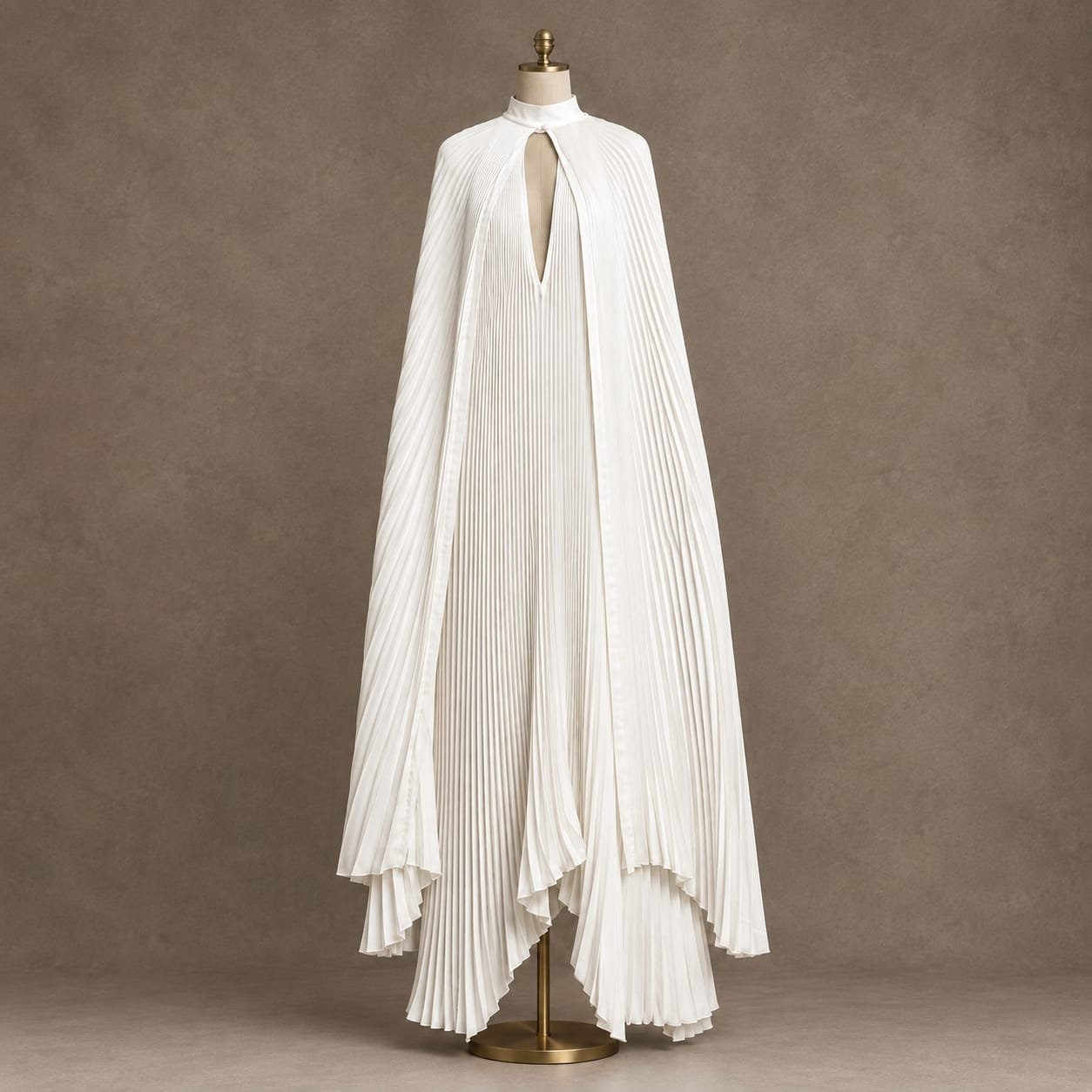 SELLBAY white pleated cape couture maxi dress displayed on a mannequin in a luxury fashion studio