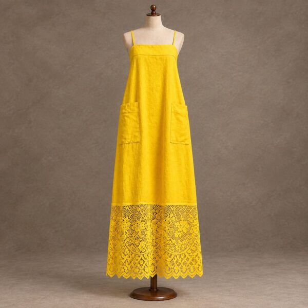 Women's bright yellow maxi dress with spaghetti straps, side pockets and floral lace hem displayed on a mannequin